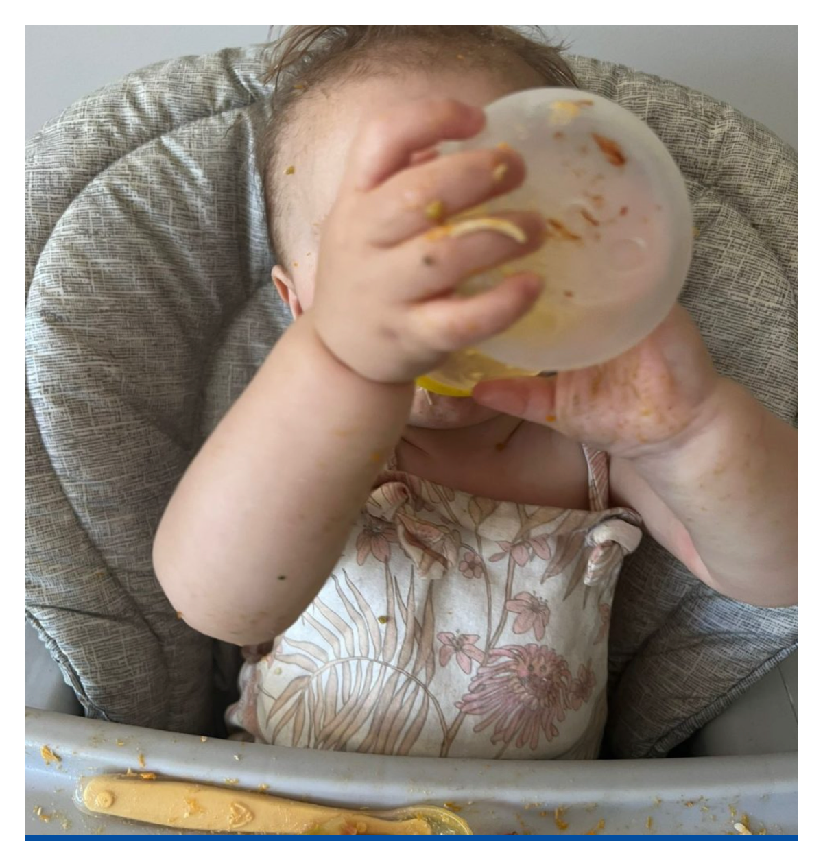 baby drinking from a cup