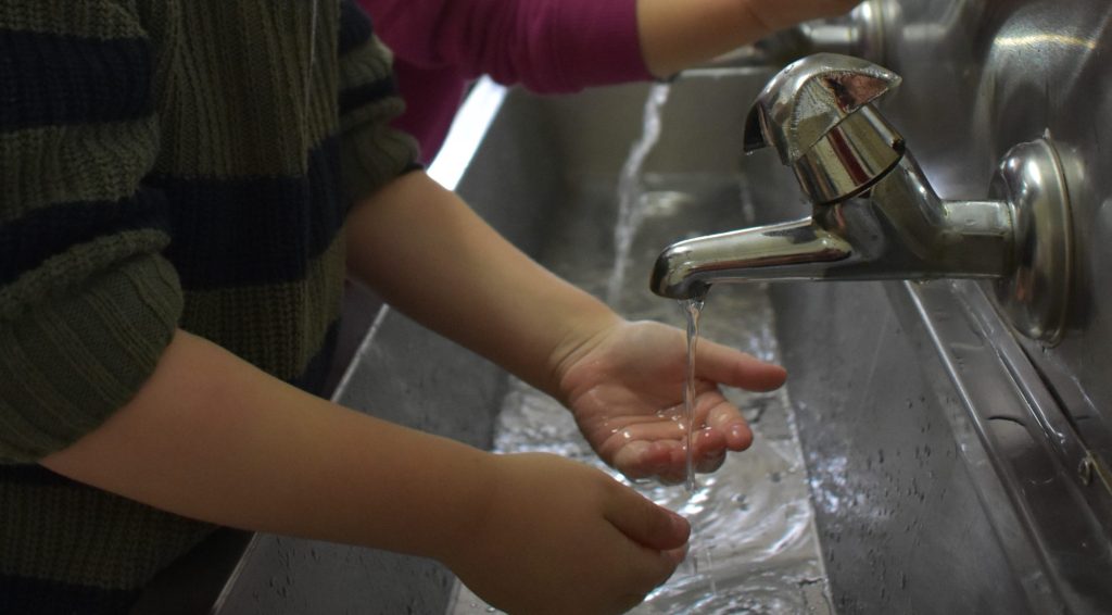 Child washing hands