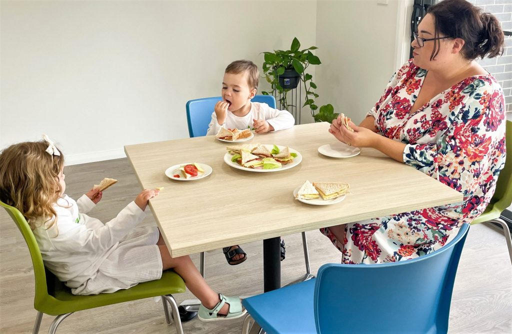 Image of all eating together at table